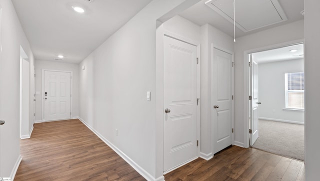 hall with dark hardwood / wood-style floors