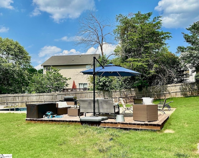 view of yard with an outdoor living space and a deck