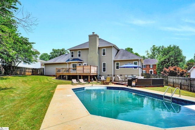 exterior space featuring outdoor lounge area, a swimming pool side deck, and a yard