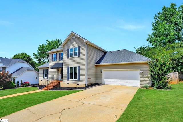 view of front property featuring a garage and a front yard