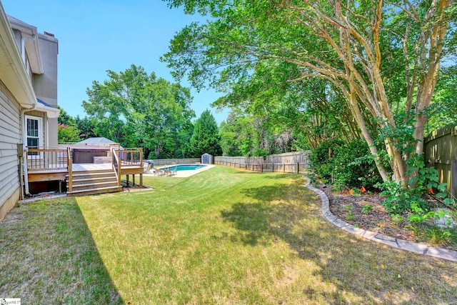 view of yard featuring a swimming pool side deck