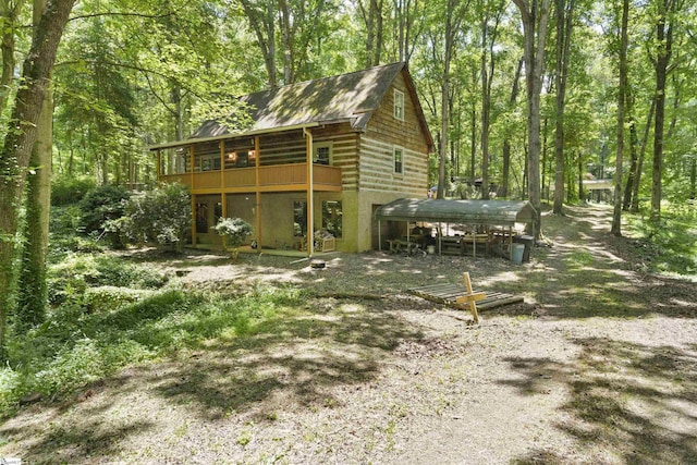 back of property featuring a sunroom