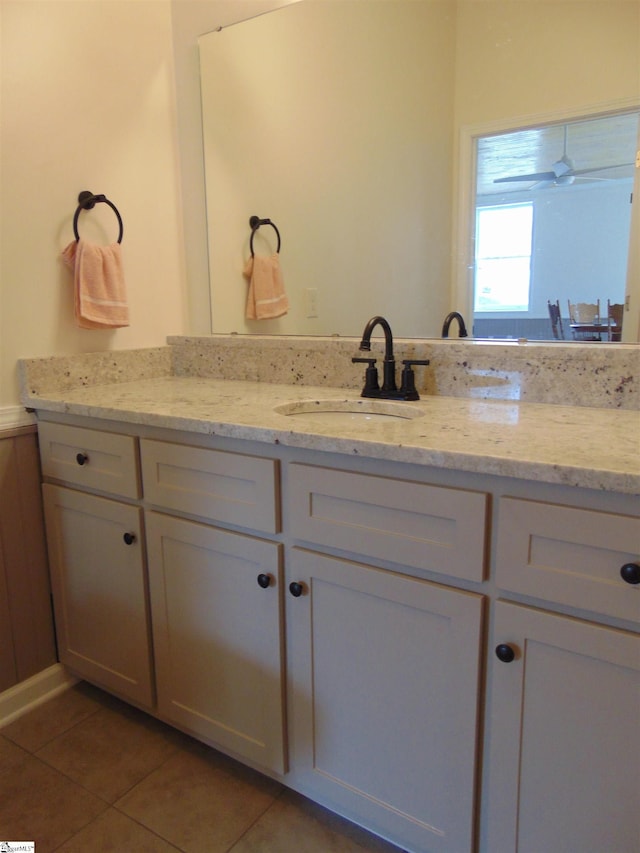 bathroom with tile patterned floors and vanity