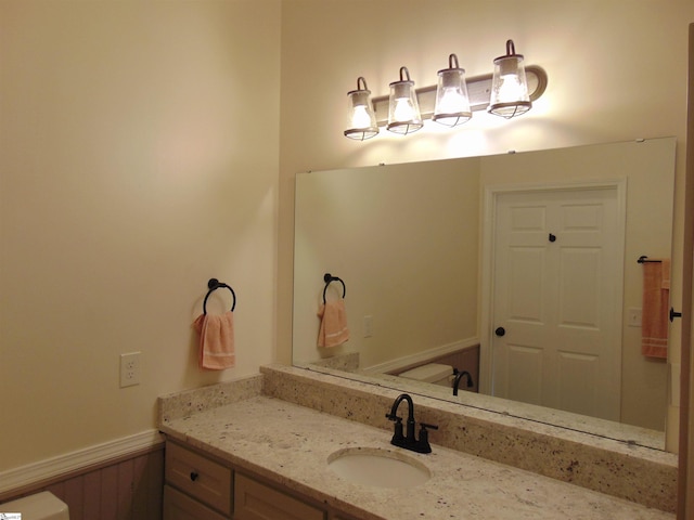 bathroom with vanity and toilet