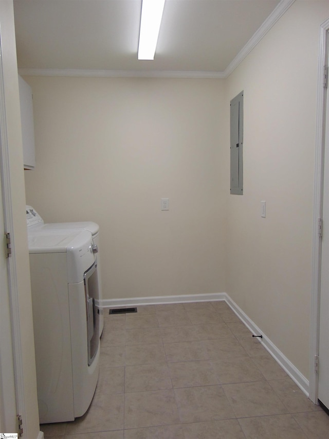 laundry room with light tile patterned floors, washing machine and dryer, electric panel, and ornamental molding