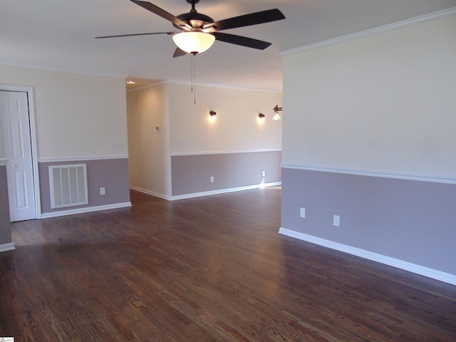 empty room featuring dark wood-type flooring, ceiling fan, and ornamental molding