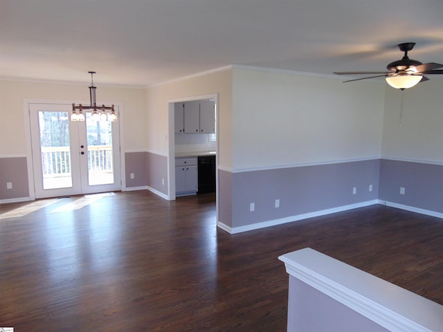 spare room with crown molding, french doors, dark wood-type flooring, and ceiling fan with notable chandelier