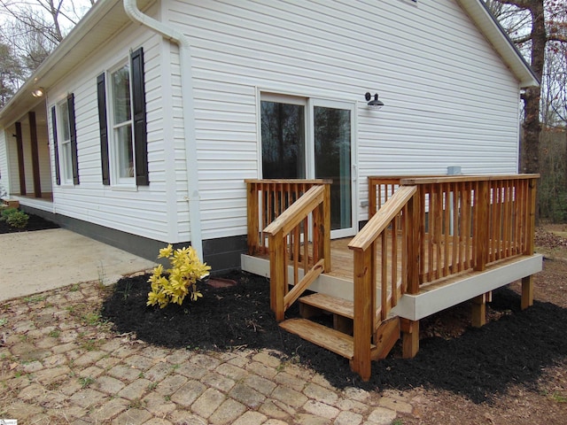 view of home's exterior featuring a deck