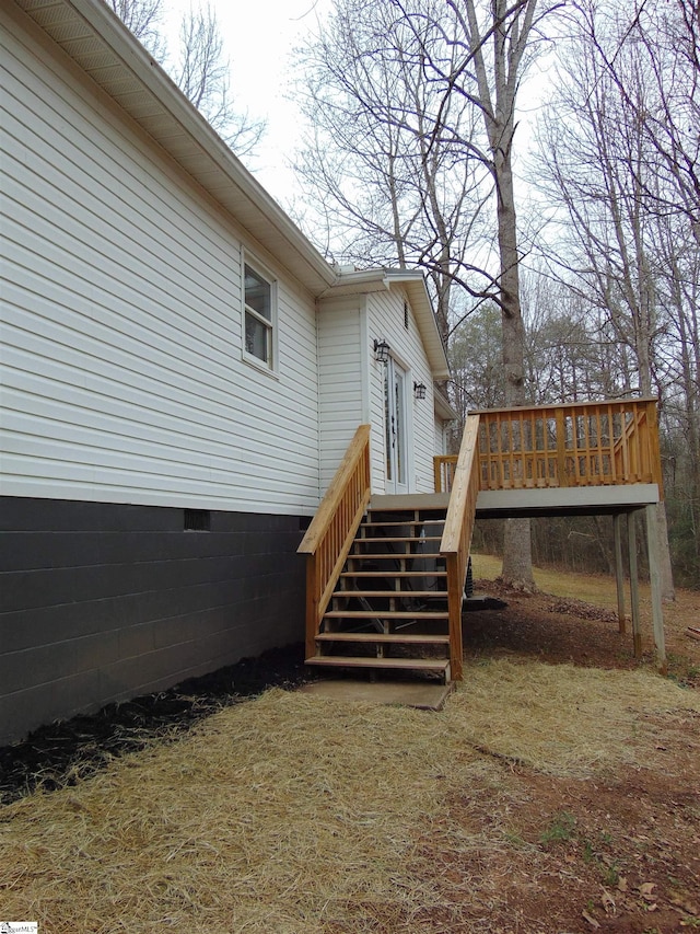 property entrance with a deck