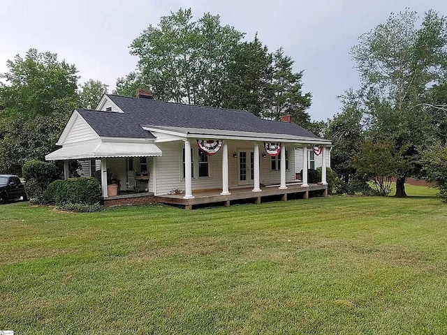 5705 State Park Rd, Travelers Rest, SC 29690 - view of front of home featuring a chimney, covered porch, and a front yard