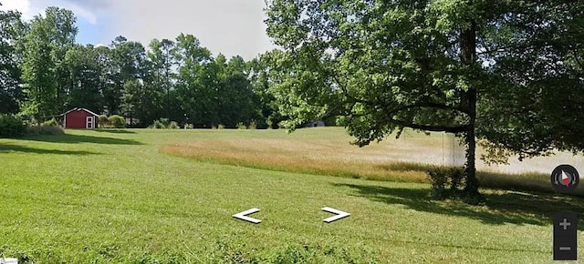 view of property's community with a lawn