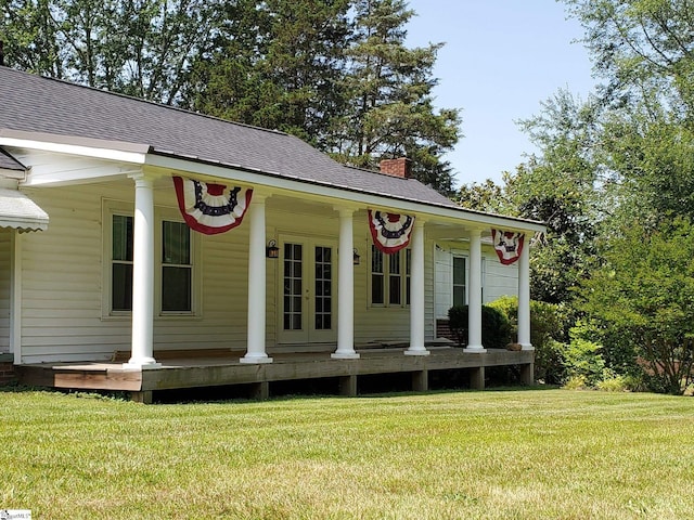 exterior space featuring a front yard and covered porch