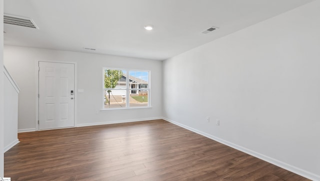 unfurnished room featuring dark hardwood / wood-style flooring