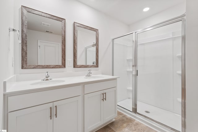 bathroom with vanity and an enclosed shower