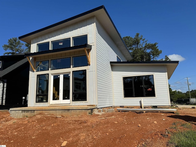 back of property featuring french doors