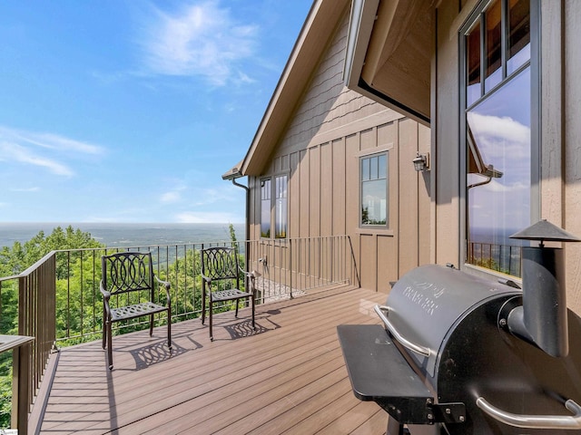 wooden deck featuring a water view