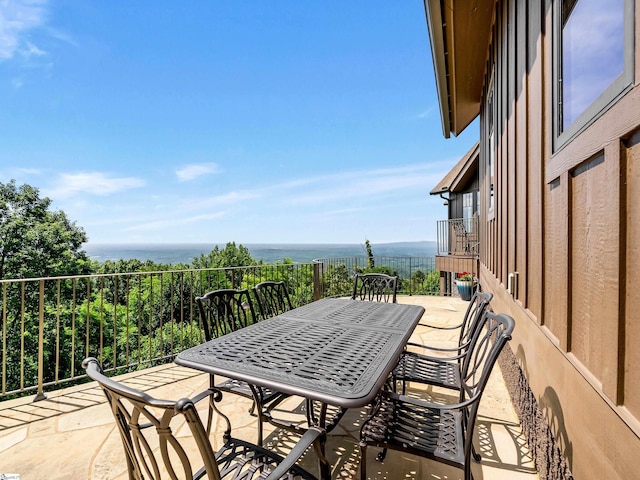 view of patio with a water view