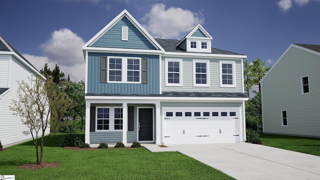 view of front facade featuring a front yard and a garage