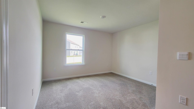 empty room featuring light colored carpet