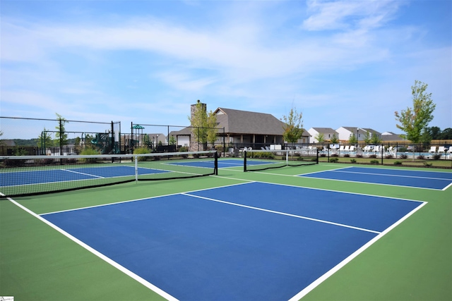 view of tennis court featuring basketball court