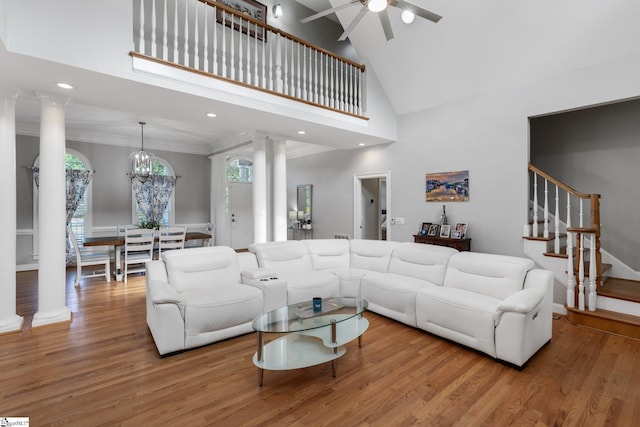 living room featuring hardwood / wood-style flooring and decorative columns