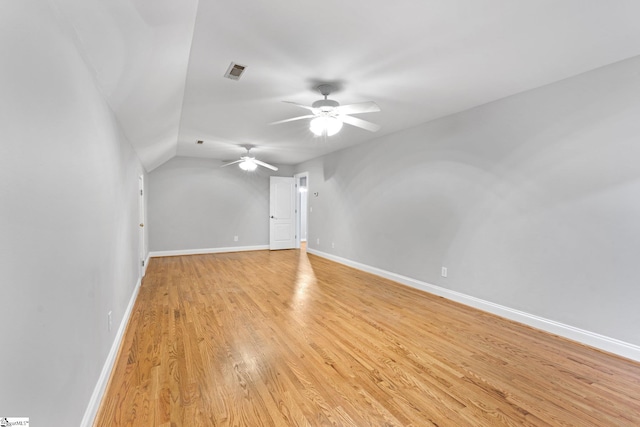 additional living space with ceiling fan, lofted ceiling, and light hardwood / wood-style floors