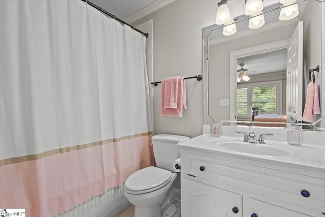 bathroom with ceiling fan, toilet, vanity, and ornamental molding