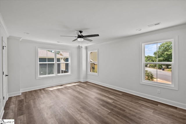 unfurnished room featuring ceiling fan, crown molding, plenty of natural light, and dark wood-type flooring