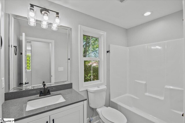 full bathroom featuring vanity, toilet, and shower / washtub combination