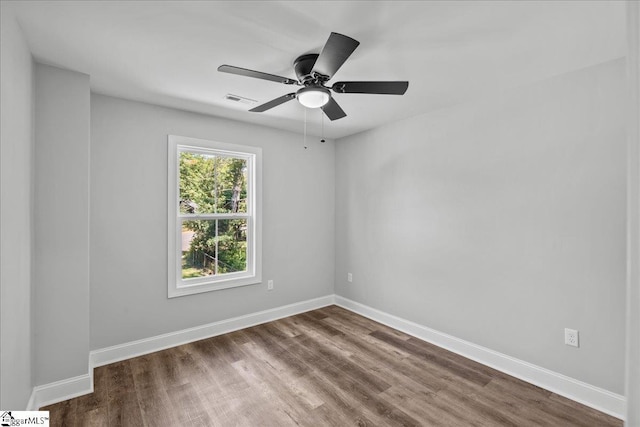 empty room with wood-type flooring and ceiling fan