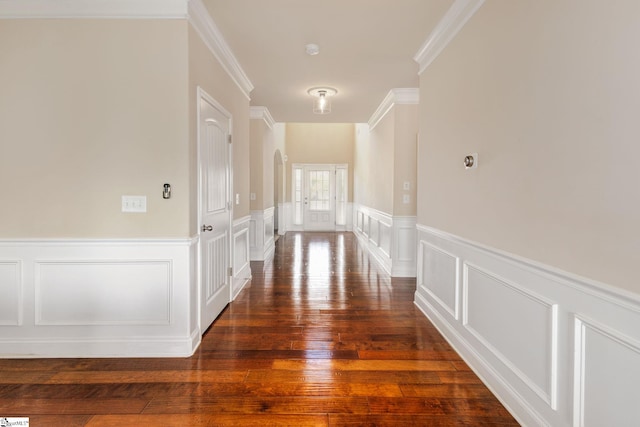 hall with dark hardwood / wood-style flooring and crown molding