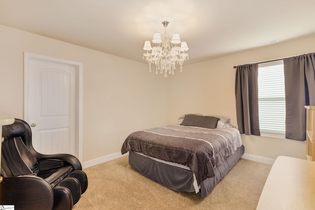 bedroom with light colored carpet and a chandelier