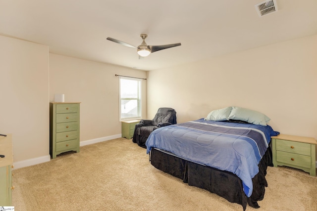 bedroom with ceiling fan and light colored carpet