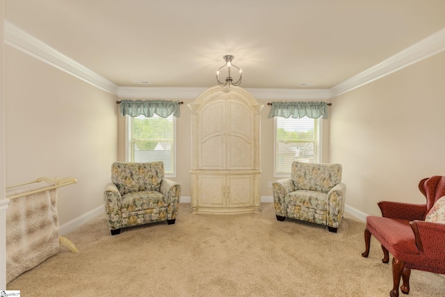 sitting room featuring ornamental molding and light carpet