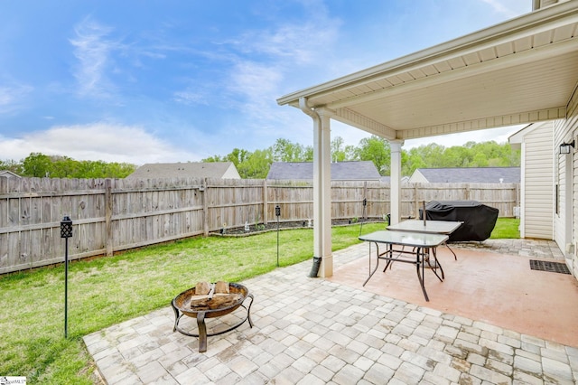 view of patio with a fire pit