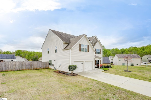 view of front of home featuring a front lawn and a garage