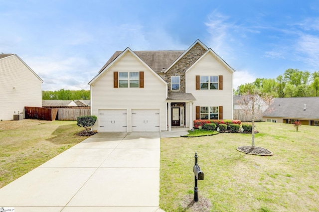 view of front of property featuring a garage and a front lawn