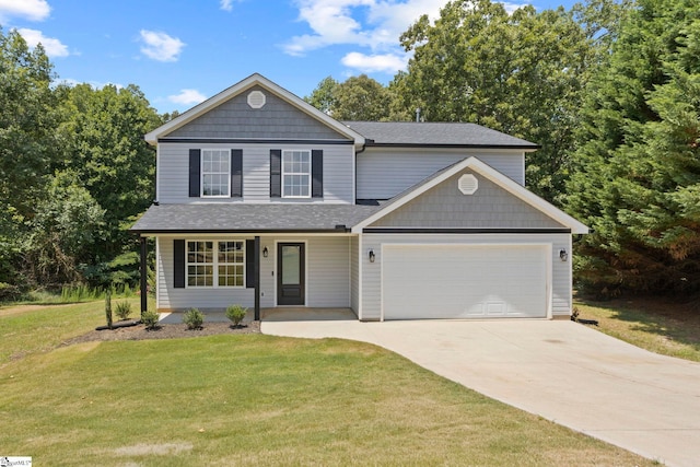 front of property featuring a front lawn and a garage