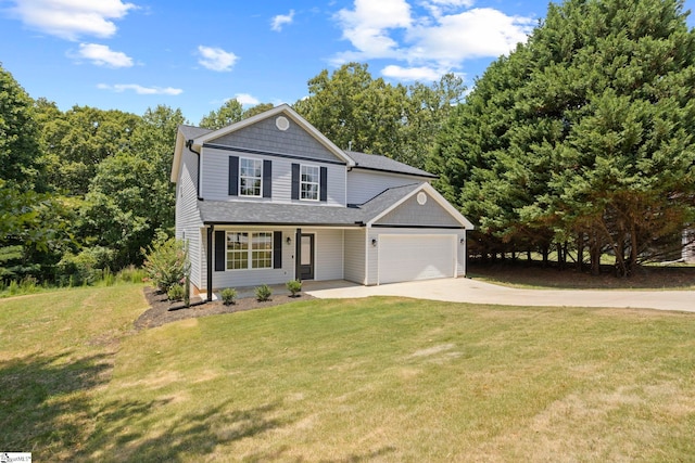 view of front property featuring a garage and a front lawn