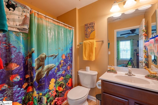 bathroom with ceiling fan, vanity, a shower with shower curtain, and toilet