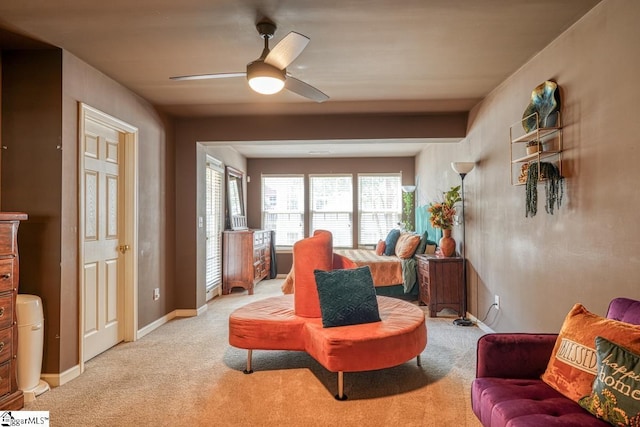 living room with ceiling fan and light carpet