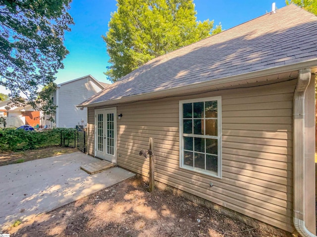 back of house featuring a patio and french doors