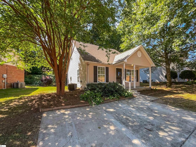 view of front of house featuring covered porch and cooling unit