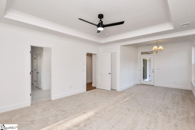 120 Club Cart Rd, Travelers Rest, SC 29690 - unfurnished bedroom with a tray ceiling, carpet floors, baseboards, crown molding, and a chandelier
