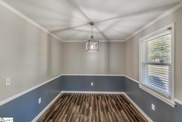 unfurnished dining area with a textured ceiling, dark hardwood / wood-style floors, and crown molding