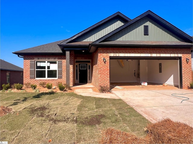 craftsman-style home with a front lawn and a garage