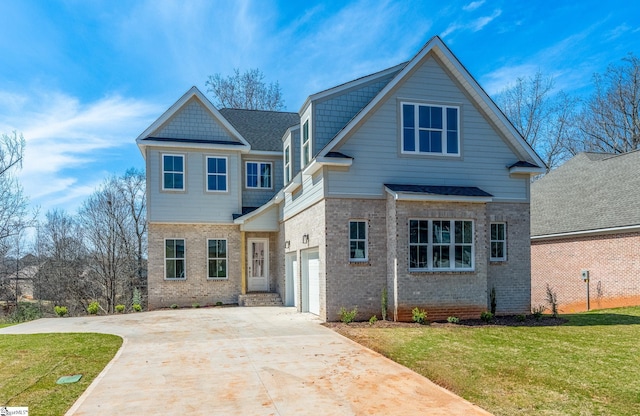 view of front of house featuring a front yard and a garage