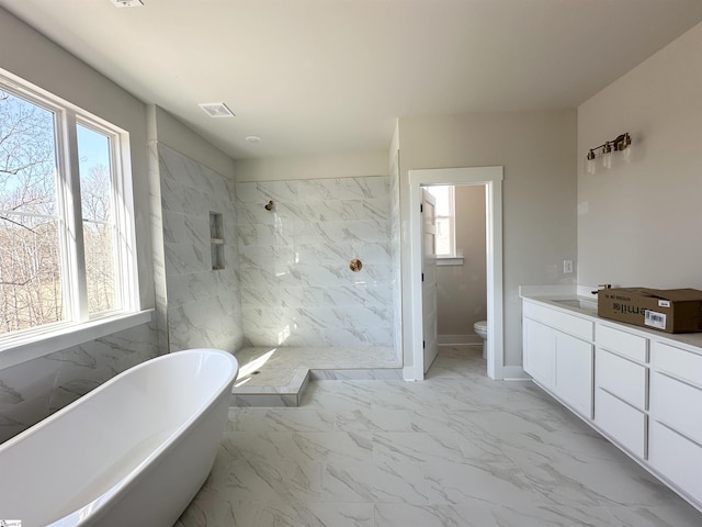 full bathroom featuring separate shower and tub, plenty of natural light, vanity, and toilet