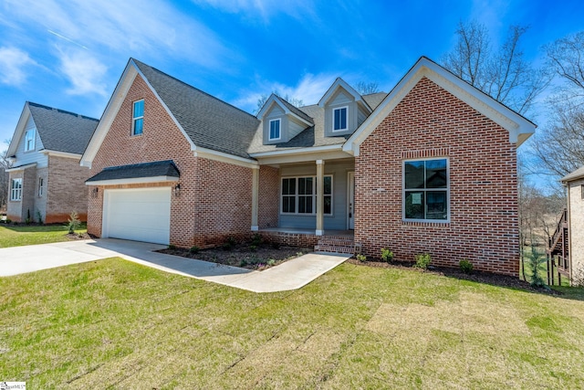 view of front of property with a garage and a front lawn