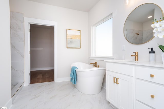 bathroom with vanity and shower with separate bathtub